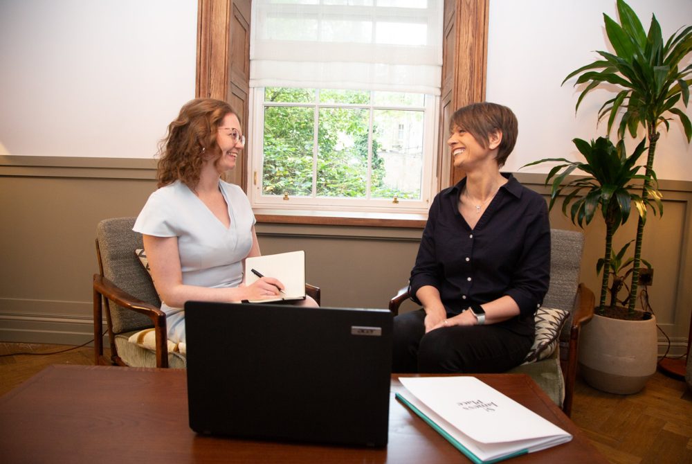 Two business owners chatting on a content day